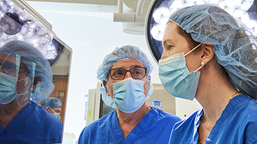 Team of doctors in operating room.