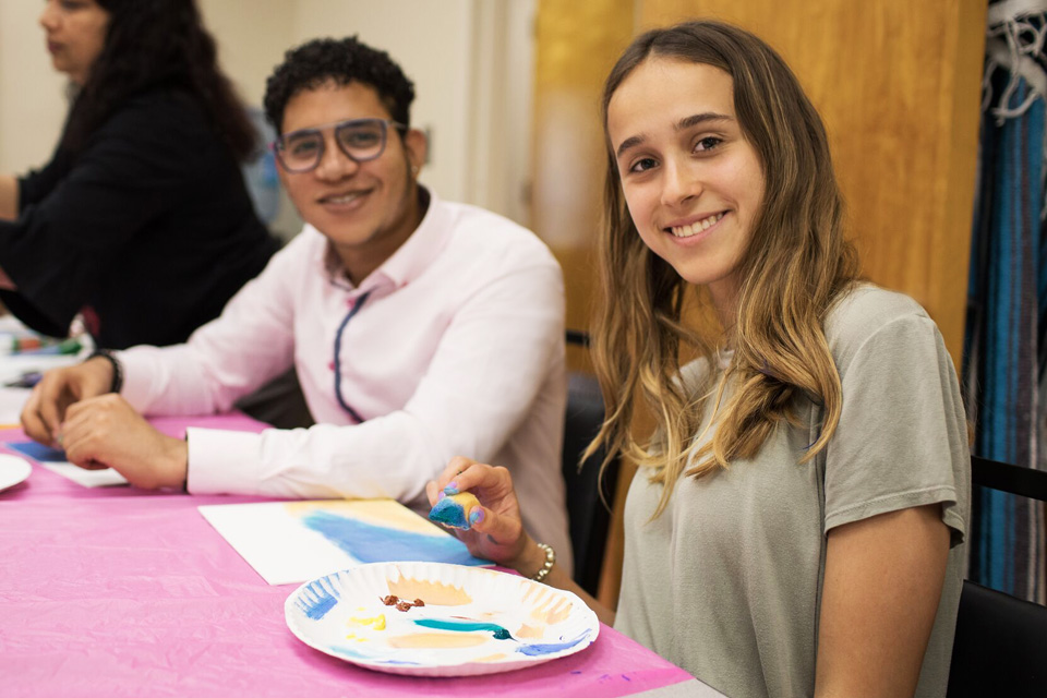 Two BOLD Peer Navigators sitting at a table