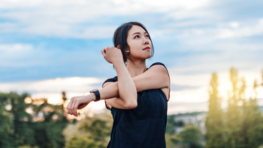 Woman streching in the park.