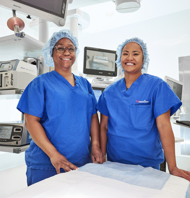 Two Montefiore Einstein medical professionals smiling.