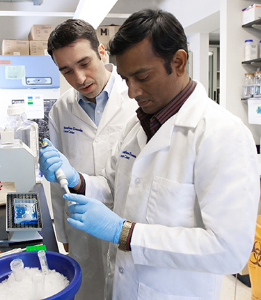 Two medical professionals engaging with state-of-the-art equipment.