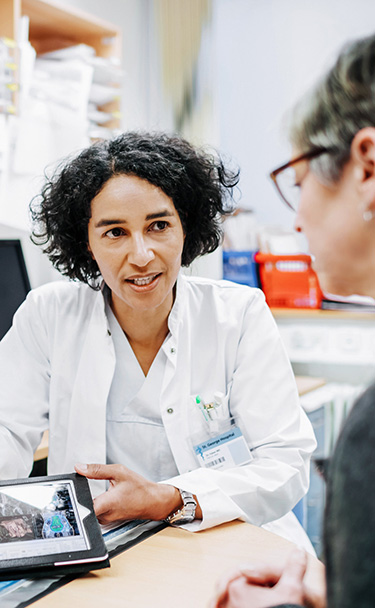 Medical professional engages with patients as part of the BRONx-CAN program. 